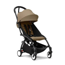 Stokke Yoyo³ stroller in black with toffee fabric, designed for children 6 months and older, featuring a compact, lightweight frame.