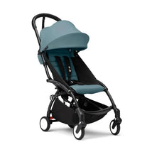Stokke Yoyo³ stroller in aqua with black frame, featuring a reclining seat and adjustable canopy. Suitable for children 6+.