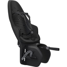 Thule Yepp 2 Maxi Rack Mount in Midnight Black, a child bike seat with adjustable straps and a sleek design.