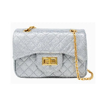 Classic quilted silver mini bag with sparkling texture and gold chain strap, featuring a gold clasp closure.