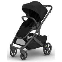 Uppababy Cruz V3 Stroller in James color, featuring a black frame and black leather accents, is shown in an upright position.
