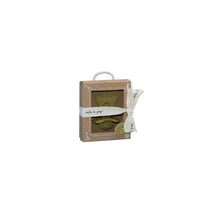 Vulli So Pure Sophie La Giraffe chewing rubber teether in a gift box with a ribbon, suitable for infants.
