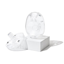 Willow 360 breast pump flanges, 21mm breast shield, displayed on a white pedestal, showcasing their transparent design.