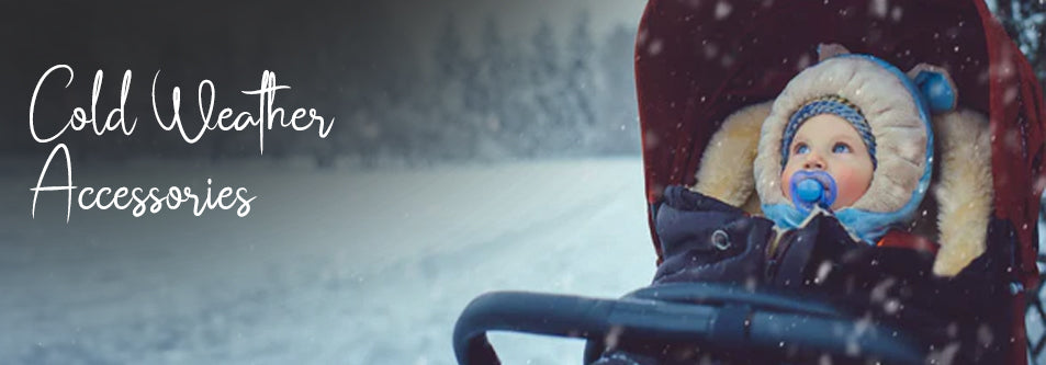 Baby in stroller wearing winter hat and coat, snow falling, cold weather accessories