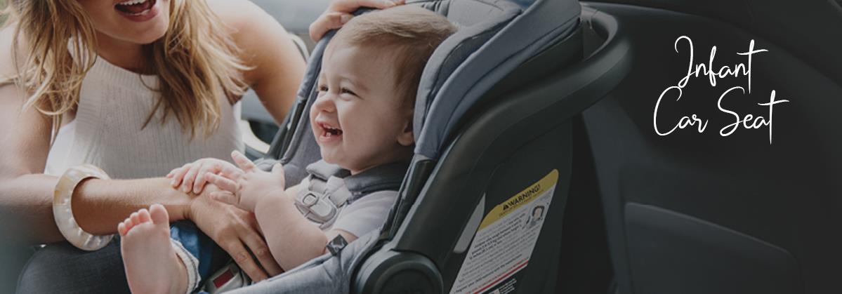 Happy baby in infant car seat with mom, safe travel for newborns and toddlers