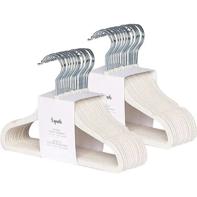 15-pack of cream-colored velvet baby hangers with chrome hooks, designed for lightweight clothing storage.