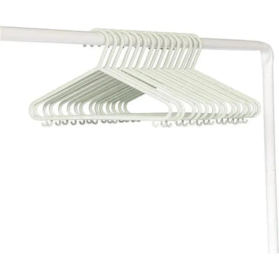 15 speckled green baby hangers made of wheat straw, neatly arranged on a white rack.
