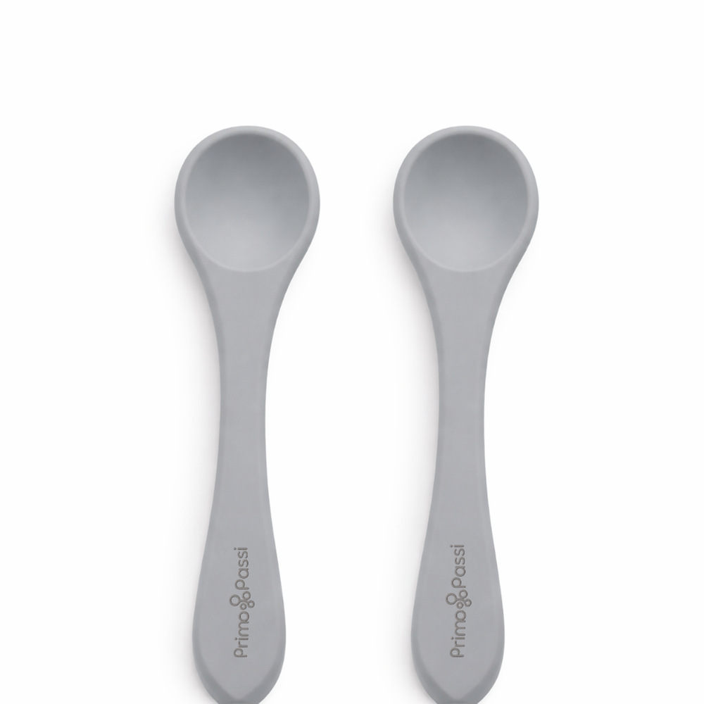 Two Primo Passi silicone baby spoons in senior grey