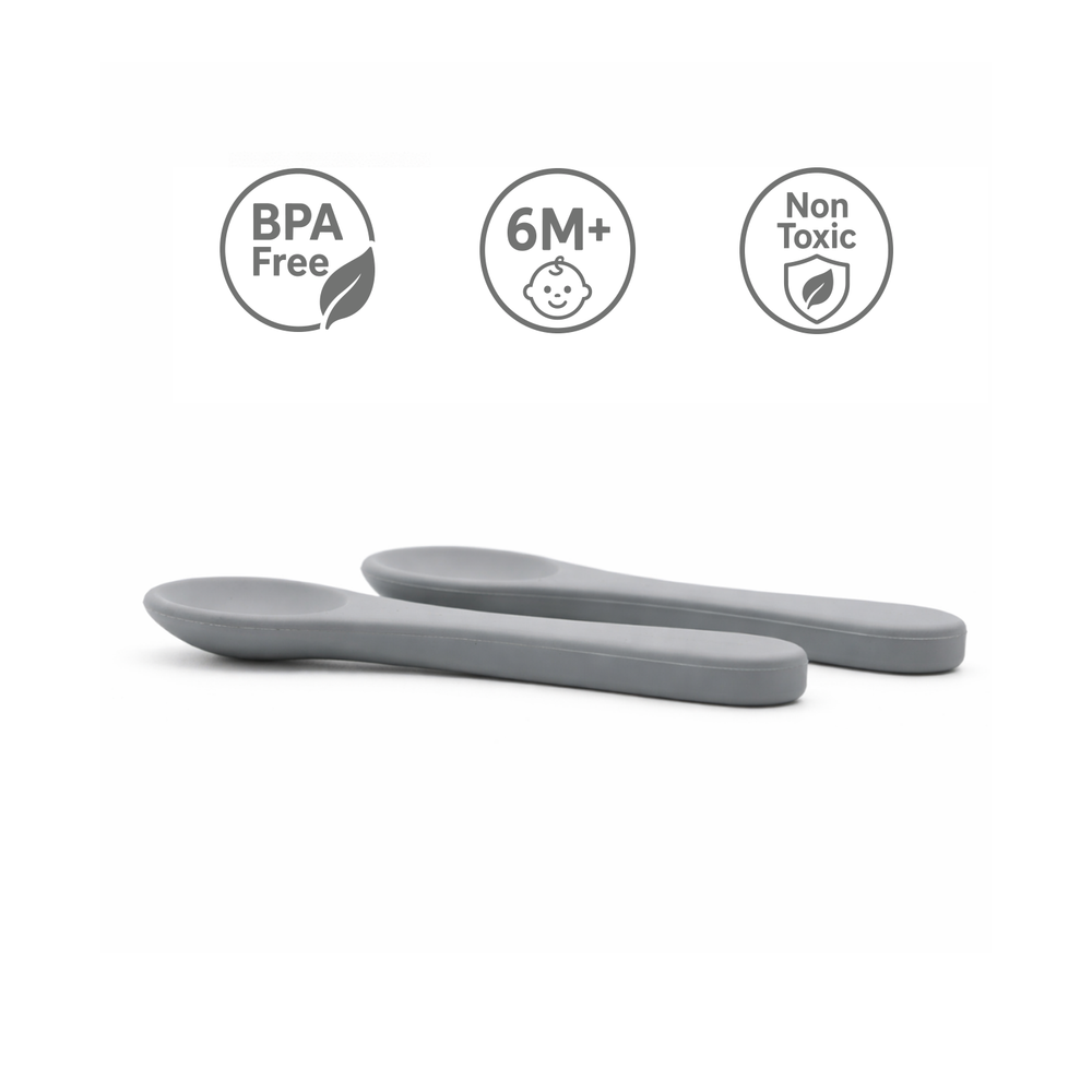 Two Primo Passi senior grey silicone baby spoons with BPA Free and Non Toxic certifications.