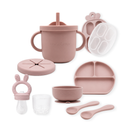 Primo Passi rose pink silicone baby feeding set with suction bowl, plate, cup, and utensils.