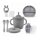 Primo Passi grey silicone baby feeding set with suction bowl, plate, cups, and spoons.