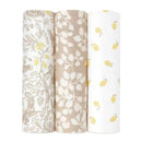 Three Aden + Anais swaddle wraps: one features woodland animals, the second has a leaf pattern, and the third is printed with lemons.