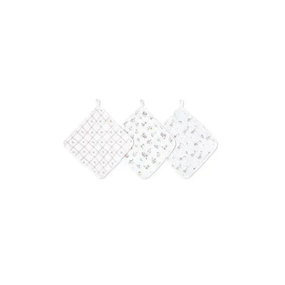 Three classic washcloths from Aden + Anais feature a grid pattern and floral designs, ideal for baby care.