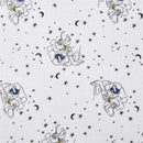 Muslin swaddle featuring playful Mickey Mouse designs against a starry night background with crescent moons.