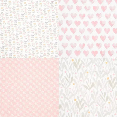 Four muslin swaddles featuring pastel designs: floral prints, hearts, and dotted patterns.