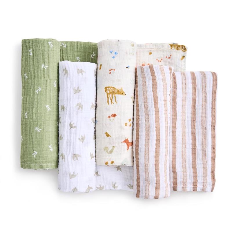 Four packs of cotton muslin swaddles in various designs, including sage green, white with animal prints, and tan stripes.