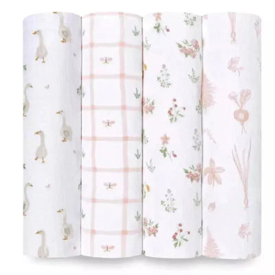 Four Aden + Anais muslin swaddle blankets featuring various patterns: geese, a pink grid, floral designs, and soft botanical illustrations.