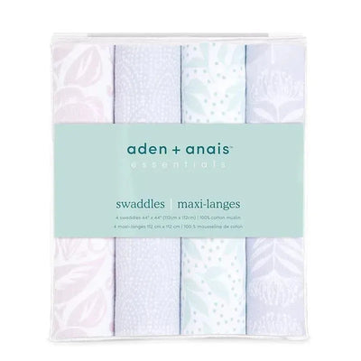 Four Aden + Anais muslin swaddles in pastel colors with floral and patterned designs, packaged for easy storage.