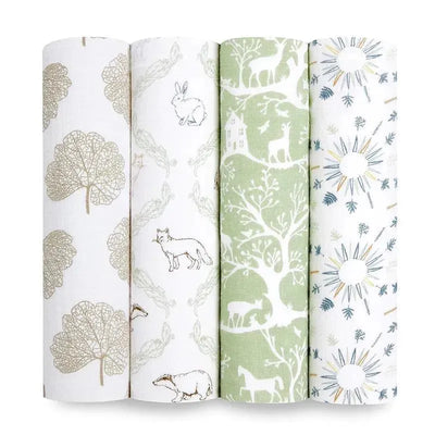 Four rolls of Aden + Anais muslin swaddles featuring nature-themed patterns: trees, animals, and sun designs in soft colors.