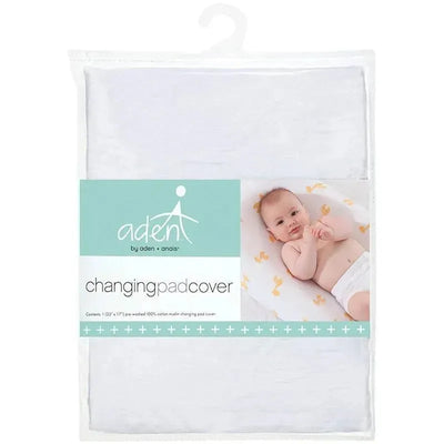 Aden + Anais white changing pad cover package featuring a baby laying on a soft changing pad with a light pattern.
