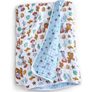 Cotton muslin blanket featuring Toy Story characters, including Woody, with colorful cacti and stars on a white background.