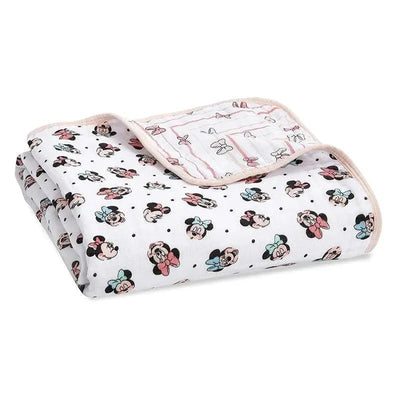 Muslin blanket featuring a Minnie Mouse design with rainbows and polka dots, folded neatly with a pastel border.