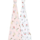 Two muslin swaddles featuring Disney Princess designs: one pink with princess illustrations, the other white with floral patterns.