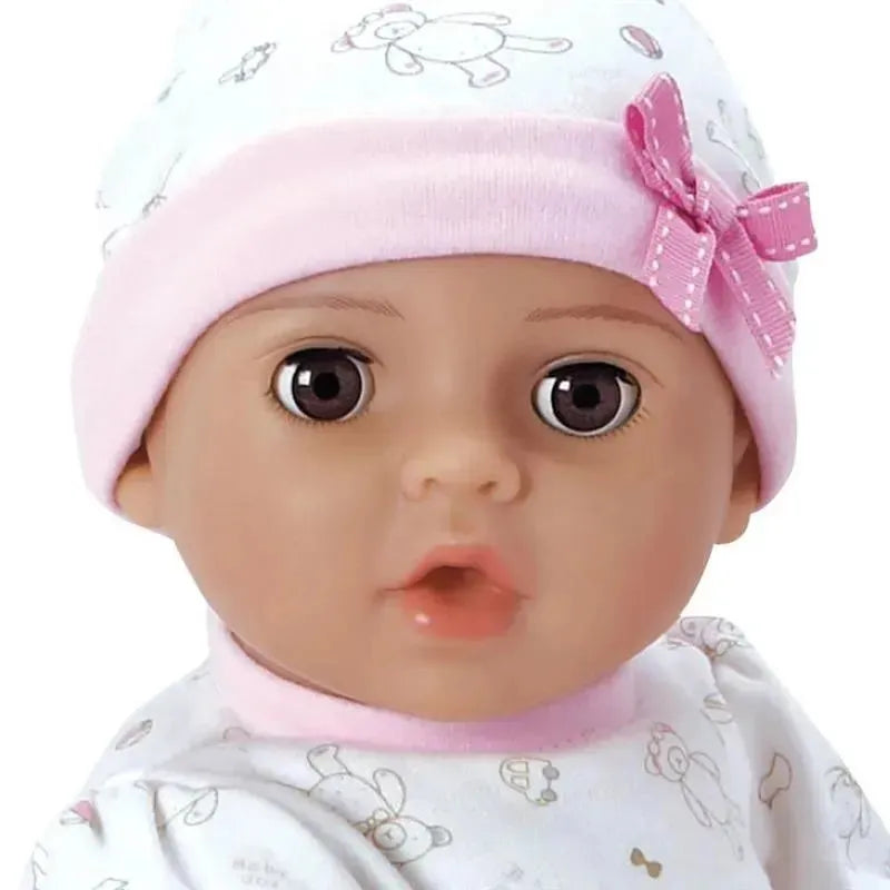 Baby doll Adoa Adoption, Cherish, wearing a pink hat with a bow and patterned onesie, with realistic features.