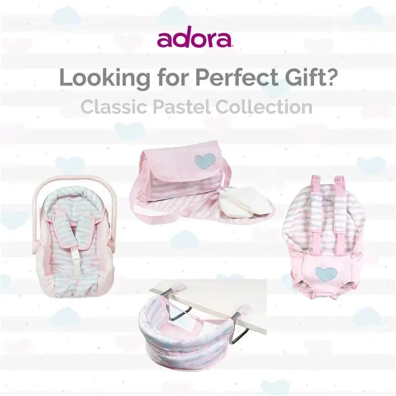 Adora Baby Doll Diaper Bag set in classic pastel pink, featuring a changing mat, two doll diapers, and a seat.
