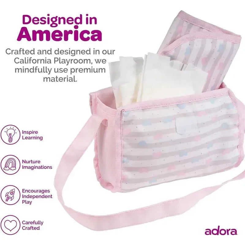 Baby doll diaper bag in pastel pink with changing mat and doll diapers, designed to inspire imaginative play.