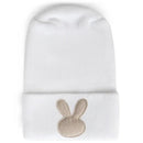 White hospital hat with a rolled cuff and a beige bunny appliqué on the front. Ideal for newborns.