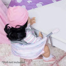 Pastel pink feeding seat for dolls, featuring a soft fabric design and adjustable straps; doll not included.