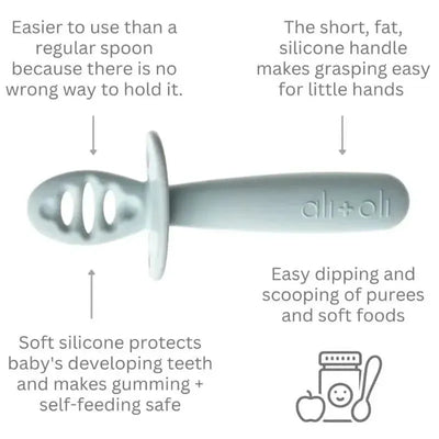 A blue silicone baby spoon with a fat handle for easy gripping, featuring text on benefits like safety for teeth and ease of use.
