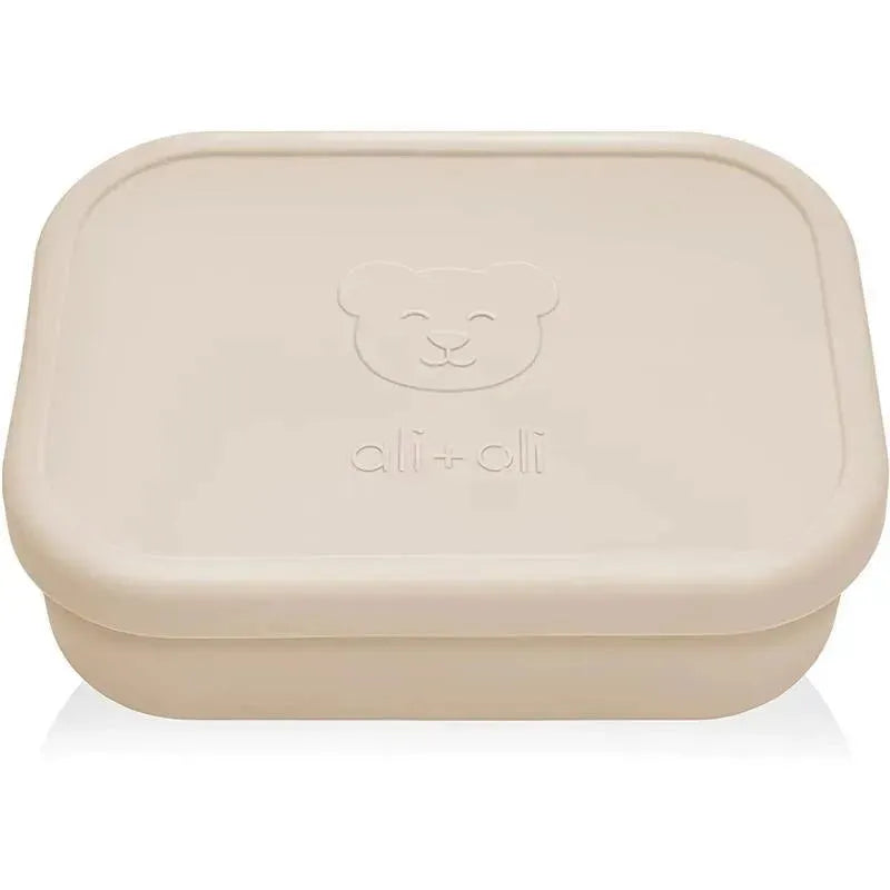 Leakproof silicone Bento box by Ali + Oli in coco color, featuring a bear logo and a rectangular design.