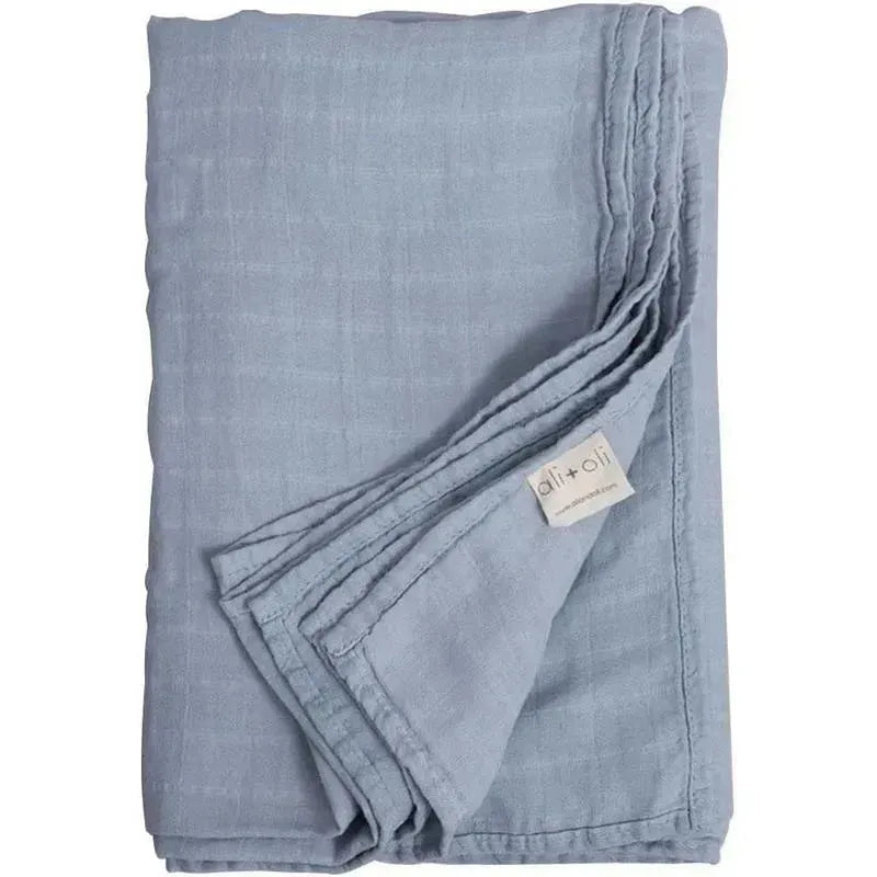 Ali + Oli muslin swaddle blanket in Dream Blue, featuring soft, breathable fabric with a textured finish.