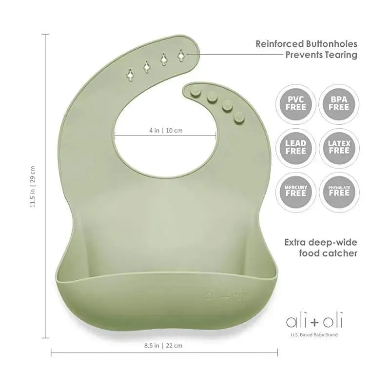 Light sage silicone baby bib with reinforced buttonholes and a deep food catcher, featuring safety certifications.