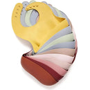 Silicone baby bibs in various colors, including light sage, designed for easy cleaning and roll-up storage.