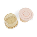 Silicone food containers in blush and khaki, each with a lid and measuring markings on the side.