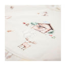 Smock bib featuring woodland illustrations, including a moose, snail, and a wooden cabin, with visible water droplets.