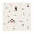 Whimsical woodland-themed design featuring animals like deer, foxes, and bears around a cabin.