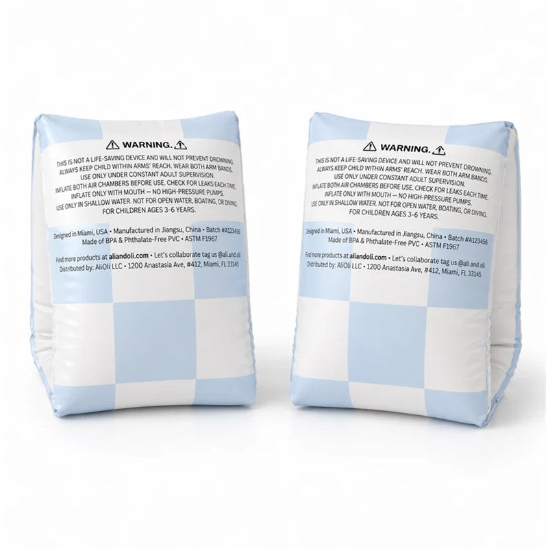 Inflatable blue checkered swim arm band wings for children, with safety warnings and usage instructions visible.