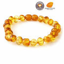 Baroque Baltic amber bracelet featuring smooth, irregularly shaped amber beads in varying shades of yellow and orange.
