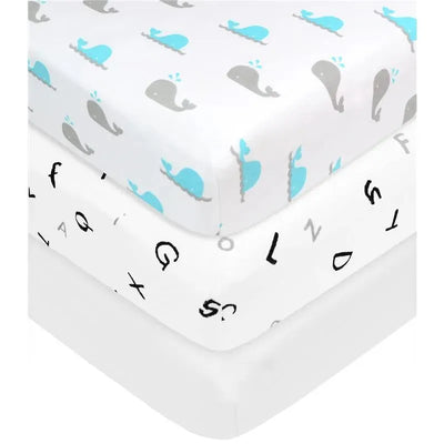 Grey bassinet sheets featuring playful whale and alphabet patterns, made of 100% cotton jersey.