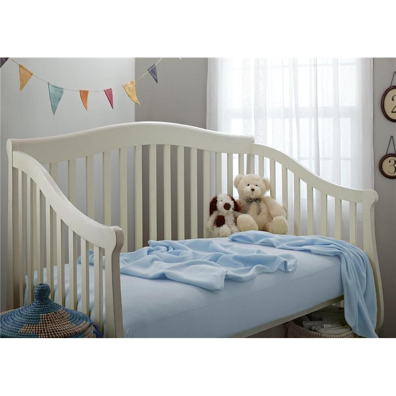 Blue thermal waffle swaddle blanket draped over a crib mattress, with plush teddy bears and a decorative banner in the background.