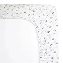 Grey fitted crib sheet with printed sports motifs, including soccer balls, basketballs, and baseballs on soft cotton.