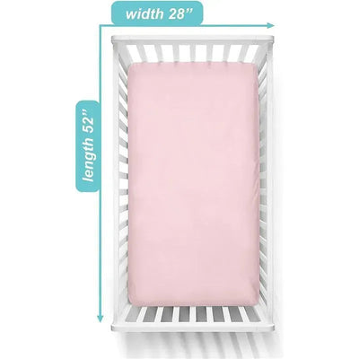 Supreme 100% natural cotton jersey knit fitted crib sheet in pink, measuring 28” width and 52” length, placed in a white crib.