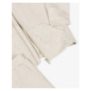 Beige tracksuit for baby boys featuring a zip-up jacket with a flocked logo and matching pants with logo-patterned pockets.