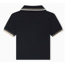 Navy short sleeve polo shirt for baby boy with cream and navy piping details on the collar and sleeves.
