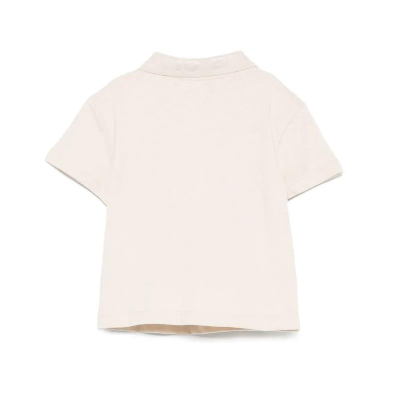 Short sleeve polo shirt for baby boys in oak color, featuring a collar and button closure at the back.