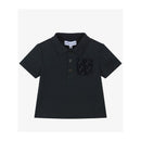 Navy short sleeve polo shirt for boys featuring a three-button placket and a printed pocket with logo detail.